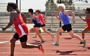 Brenda Matthews (red), Linda Cohn (middle) and Pat Kelly (blue) battle in a 50.