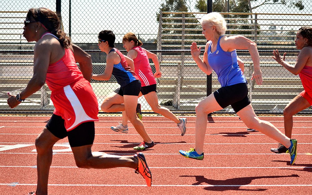 Brenda Matthews (red), Linda Cohn (middle) and Pat Kelly (blue) battle in a 50.
