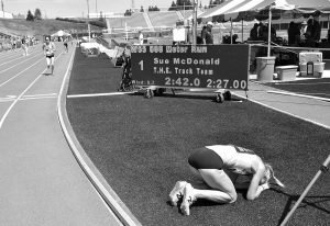 Sue McDonald recovers on infield after setting a W55 American record in the 800.