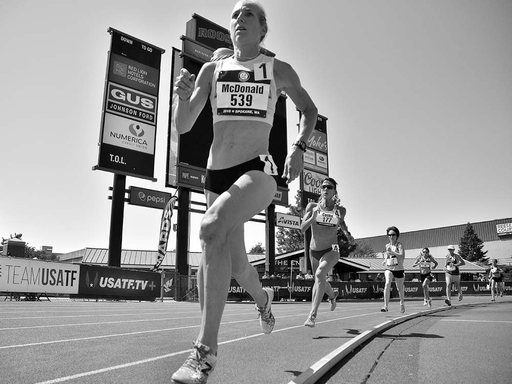 Sue McDonald leads recent W55 mile record-setter Susan "Lynn" Cooke in the 800 where she lowered her own American record.