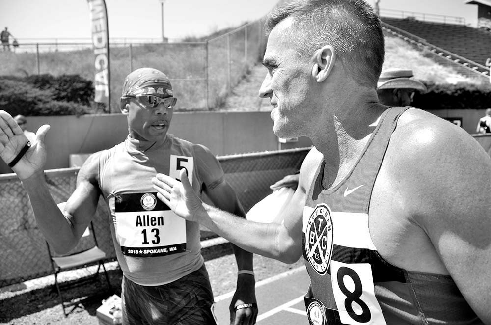 McDuffrie Allen of San Diego is congratulated by Kevin Paulk of Portland, Oregon, after the M55 800.