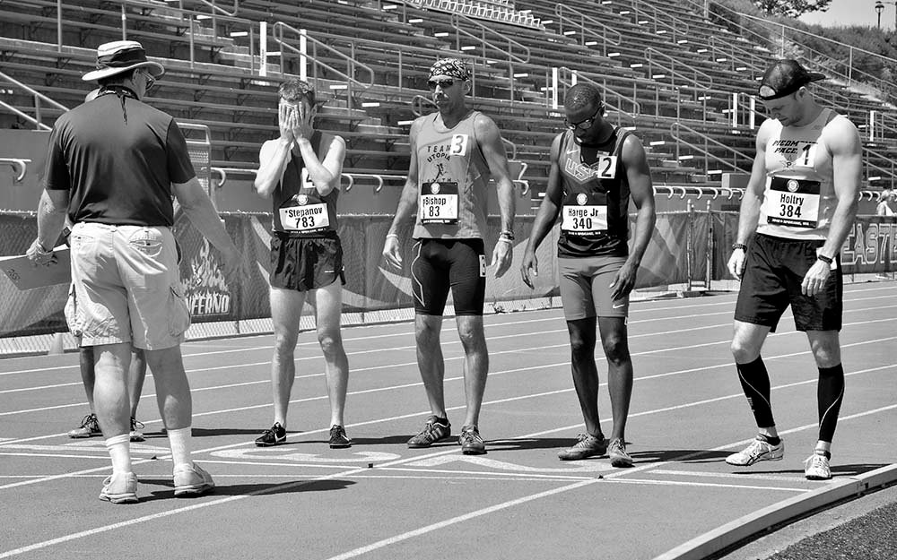 Vitaliy Stepanov covers his face before start of the M30-39 800. He was second in the M35 group.