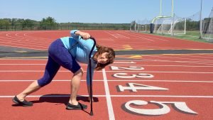 Diane plays with a cane at start of a workout as she makes comeback from knee surgery.