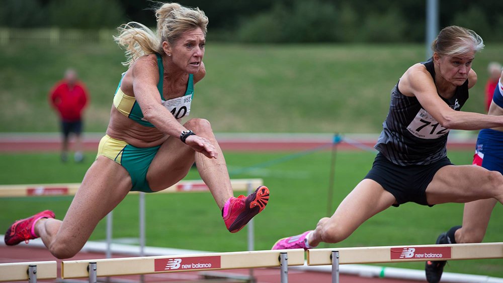 Australia's Michele Hossack (left) won the W55 80-meter hurdles in 14.03.