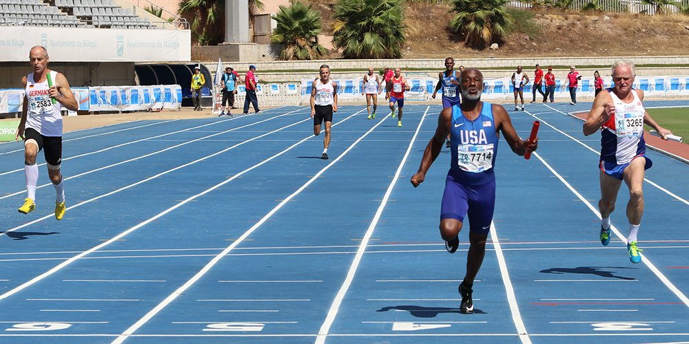 Charlie Allie anchors America's gold-medal M65 4x100 relay team at Malaga.
