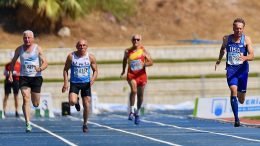 Michael Kish (right) leads Malaga heat in the M65 100. He won silver in final but wasn't on the 4x100 relay.