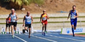 Michael Kish (right) leads Malaga heat in the M65 100. He won silver in final but wasn't on the 4x100 relay.