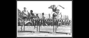 That's me leading a 4x120 shuttle low hurdle relay — going against the barrier in 1970.