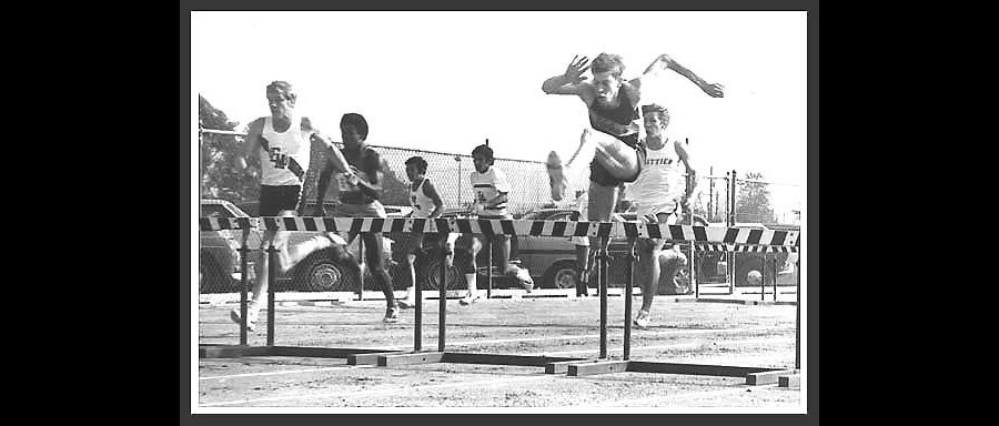 That's me leading a 4x120 shuttle low hurdle relay — going against the barrier in 1970.
