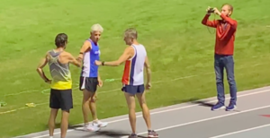 Dan King gets good-luck fist-bumps at start of Saturday's mile record attempt in Columbia, South Carolina.