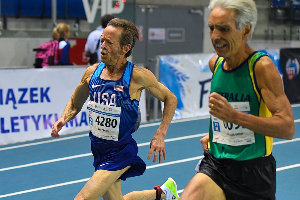 Gary Patton battled Kevin Solomon of Australia in the last few meters of the 3000 at 2019 Torun worlds, clocking 11:30.11 for M70 silver.