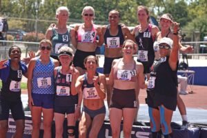 Neringa Jakstiene, (575) in front row, celebrates with fellow Ironlady pentathletes after her world record outing. Photo by Ken Stone